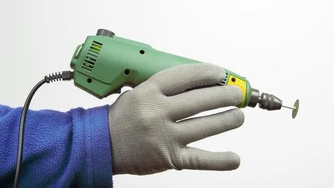 Engraving tool for cutting and processing metal and other objects in hand o.. Stock Photos