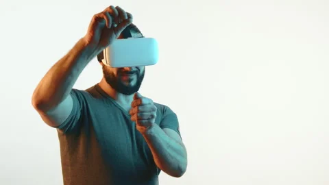 Engrossed Man Interacting with a Virtual Environment Using VR Technology Stock Footage 270255202