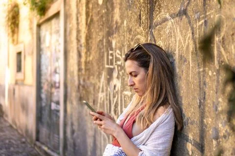 Engrossed in Technology: A Side-View, Horizontal Shot of an Unidentified In.. Stockfoto's