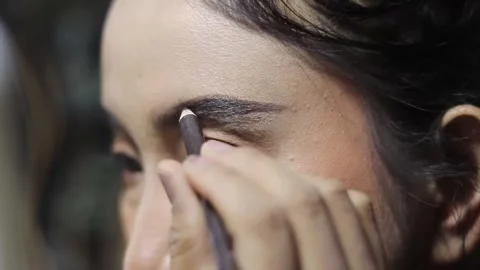 Enhancing natural beauty, shaping eyebrows with precision care. Stock Footage 313165194