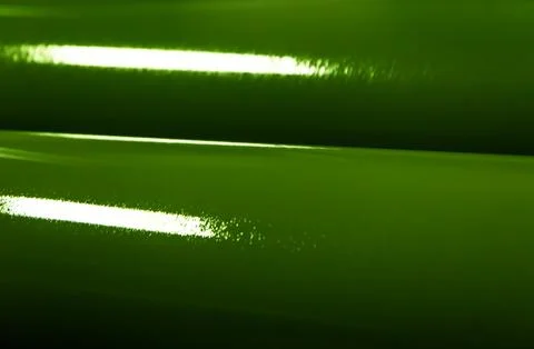 Enigmatic Emerald Elegance: A Close-Up of a Roll of Green Material Stock Photos