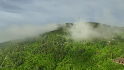 Enigmatic Heights: Aerial Exploration of 4K Cloud-Shrouded Mountains in the Jung Stock Footage 244472902