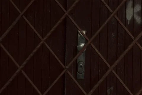 Enigmatic old gate features rusted framework and concealed entry hints Stock Photos