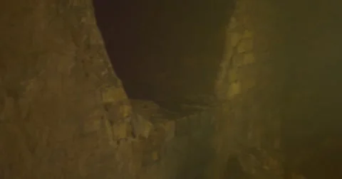 An Enigmatic Round Passage in Some Deep Tunnel, Which is Made of Grey Bricks, Stock Footage 58647467