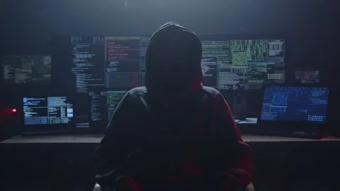 An Enigmatic Shadowy Hacker Operates in a Dimly Lit Control Room Setup Stock Footage 281759323
