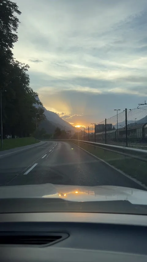 Enjoy the beautiful sunset illuminating the tranquil landscape as you travel. Stock Footage 291421964