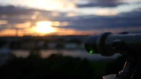Enjoy the beautiful sunset through the observation binoculars. slow motion Stock Footage 78935805