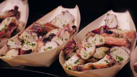Enjoy a delectable Seafood Salad dish served in Bamboo Boats at a highend Stock Footage 277418319