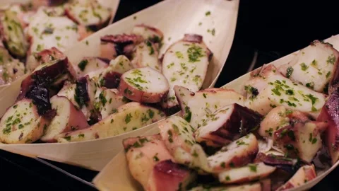 Enjoy a delectable Seafood Salad dish served in Bamboo Boats at a highend Stock Footage 280584328