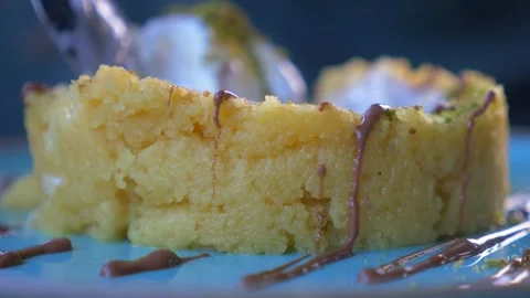 Enjoy a Delicious Slice of Moist Cake, complemented perfectly with Ice Cream and Vídeo Stock 282693906
