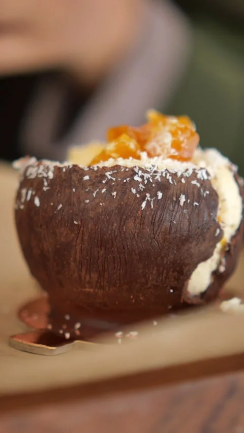 Enjoy dessert made in a chocolate cup with fruit topping Stock Footage 337809026