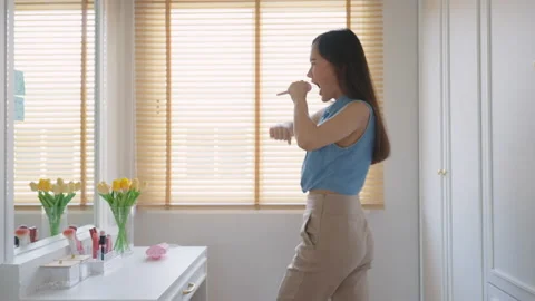 Enjoy good time dancing and singing in front of mirror and closet room Stock-Footage 202641218