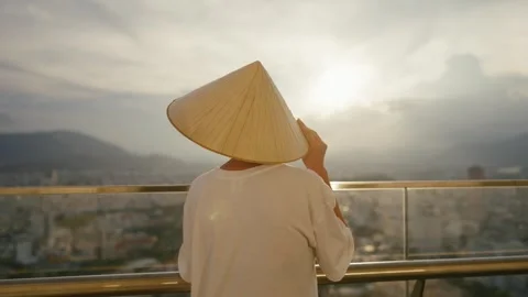 Enjoy the mesmerizing view of a serene sunset coupled with a traditional Asian Stock Footage 310929614