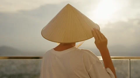 Enjoy the mesmerizing view of a serene sunset coupled with a traditional Asian Stock Footage 314819379