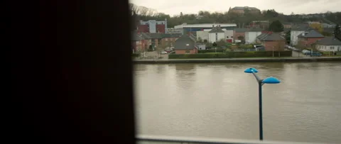 Enjoy a picturesque river view complemented by a stunning urban landscape Stock Footage 301467198