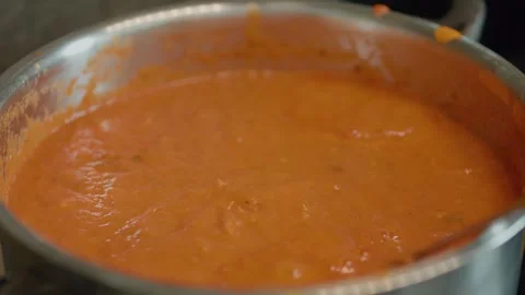 Enjoy the process of creating a delicious homemade tomato sauce Stock Footage 323368848