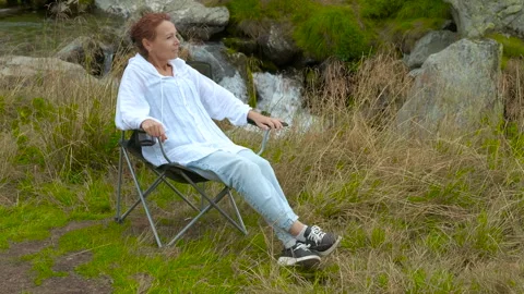 Enjoy relaxing by the stream. Stock Footage 309364577