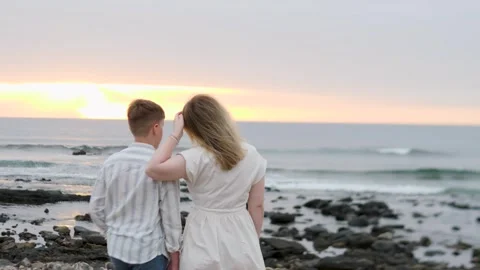 Enjoy a Romantic Sunset Stroll by the Beautiful Beach Together Stock Footage 317075094