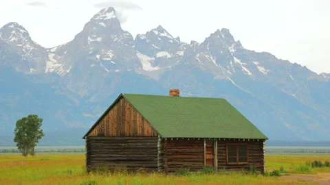 Enjoy a Rustic Cabin with Stunning Mountain Views, Ideal for Adventure and Stock Footage 313562165