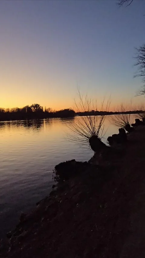 Enjoy the Serene Sunset Over Calm Waters An Exquisitely Tranquil Landscape View Stock Footage 305483092