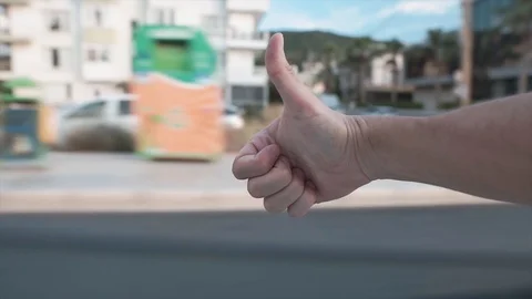 Enjoy trip concept. Hand is sticking out of car window, Yes, ok gesture. Stock Footage 113458065