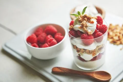 Enjoy zero guilt - just tons of yum. of granola, yoghurt and berries in a glass Stock Photos