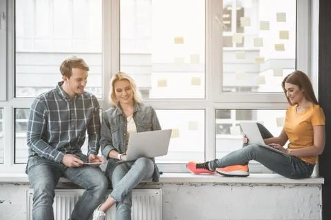 Enjoyed students browsing the internet Stock Photos