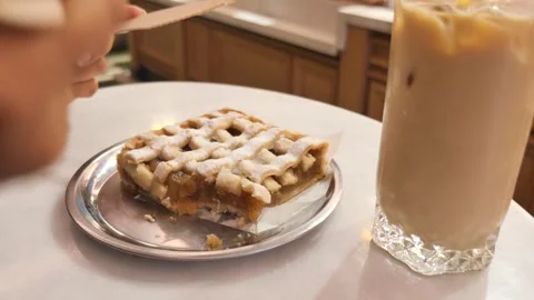 Enjoying apple pie with ice late on a cfae table Stock-Footage 325827766