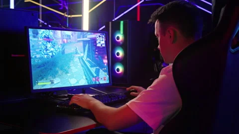 Enjoying the battle royale computer shooter game with modern cartoon graphics Stock Footage 245224921