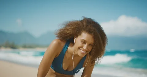 Enjoying the beach after her workout Stock Footage 124717816