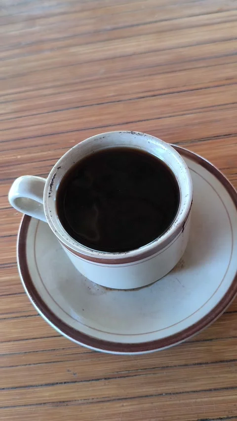 Enjoying Black Coffee During a Focused Work Session Stock Footage 338378572