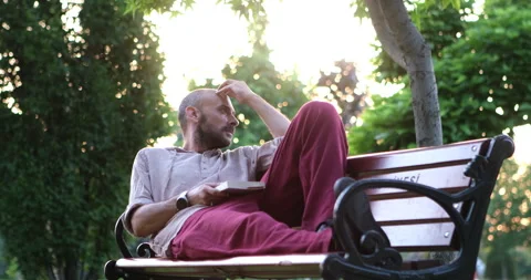 Enjoying a book in the forest Stock Footage 247005988