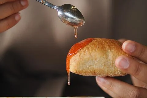 Enjoying bread with jam for breakfast or snack time Stock Photos