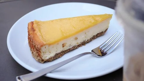 Enjoying cake slice at cafe in sunny afternoon Stock Footage 336830814