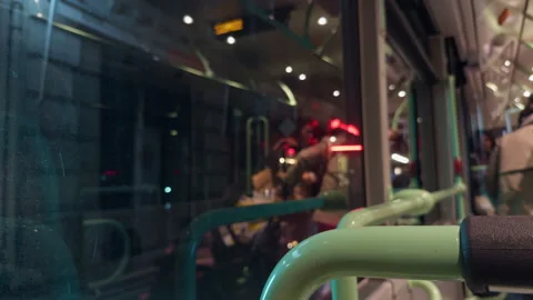 Enjoying a captivating nighttime cityscape view from a bus window an urban Stock Footage 318554765