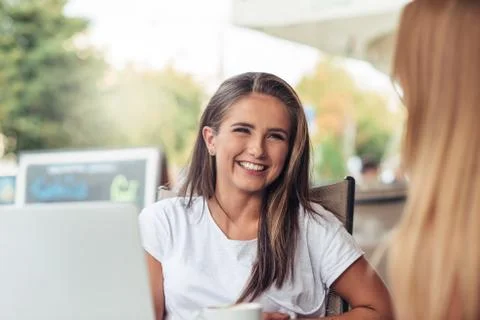 Enjoying a chat at the cafe Stock Photos
