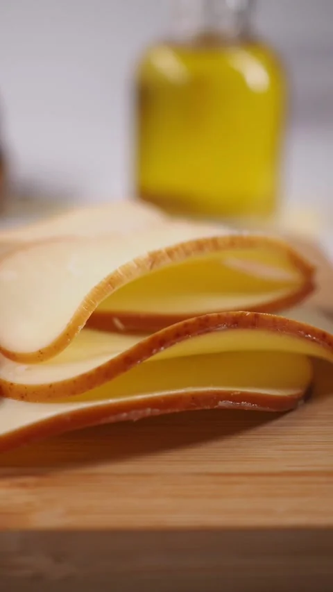 Enjoying cheese and bread with olive oil on the table Stock Footage 335854482