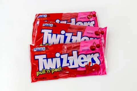 Enjoying cherry pull and peel candy at summer gathering with friends and family. Stock Photos