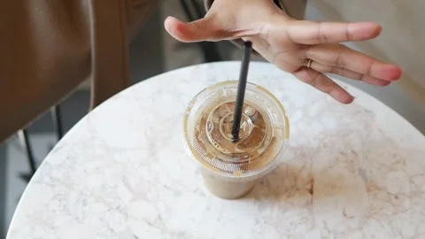 Enjoying coffee on a marble table in a cafe Stock Footage 335432429