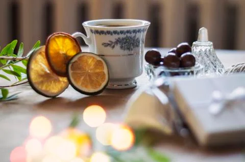 Enjoying a cup of coffee while wrapping gifts Stock Photos