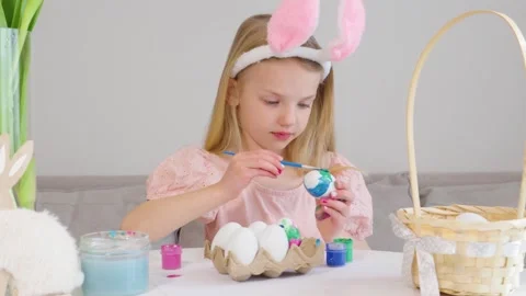Enjoying Easter fun by coloring eggs with creative designs Stock Footage 302043102