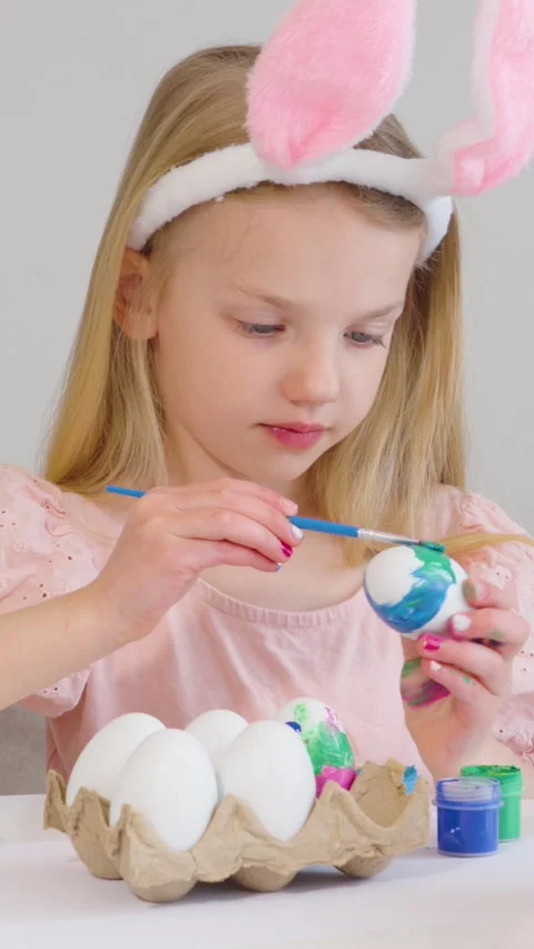 Enjoying Easter fun by coloring eggs with creative designs Stock Footage 302068498