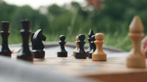 Enjoying an engaging and intellectually stimulating chess game in the beautiful Video stock 306051869