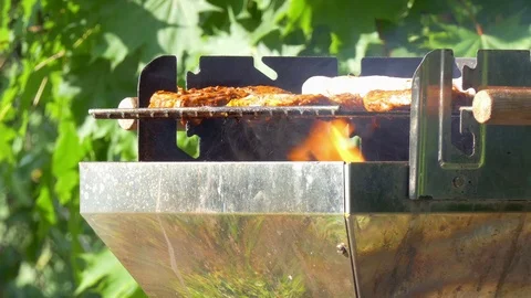 Enjoying the evening at the barbecue Stockbeeldmateriaal 76087262