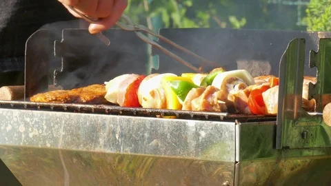 Enjoying the evening at the barbecue Stock Footage 76087506