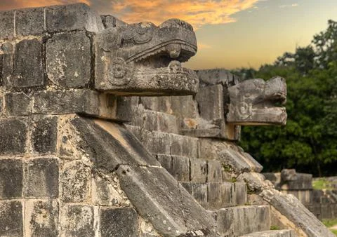 Enjoying the God Kukulkan on the platform of eagles. Pyramid of Chichen Itza. Stock Photos