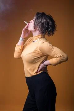 Enjoying her cigarette Stock Photos