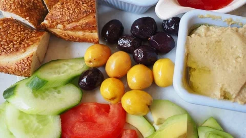 Enjoying humus with vegetables and bread in a cafe Stock Footage 337752200