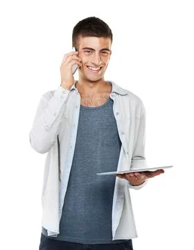 Enjoying the latest developments of technology. A smiling male talking on his Stock Photos
