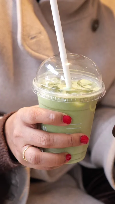 Enjoying a matcha drink at a cafe Stock Footage 333030571